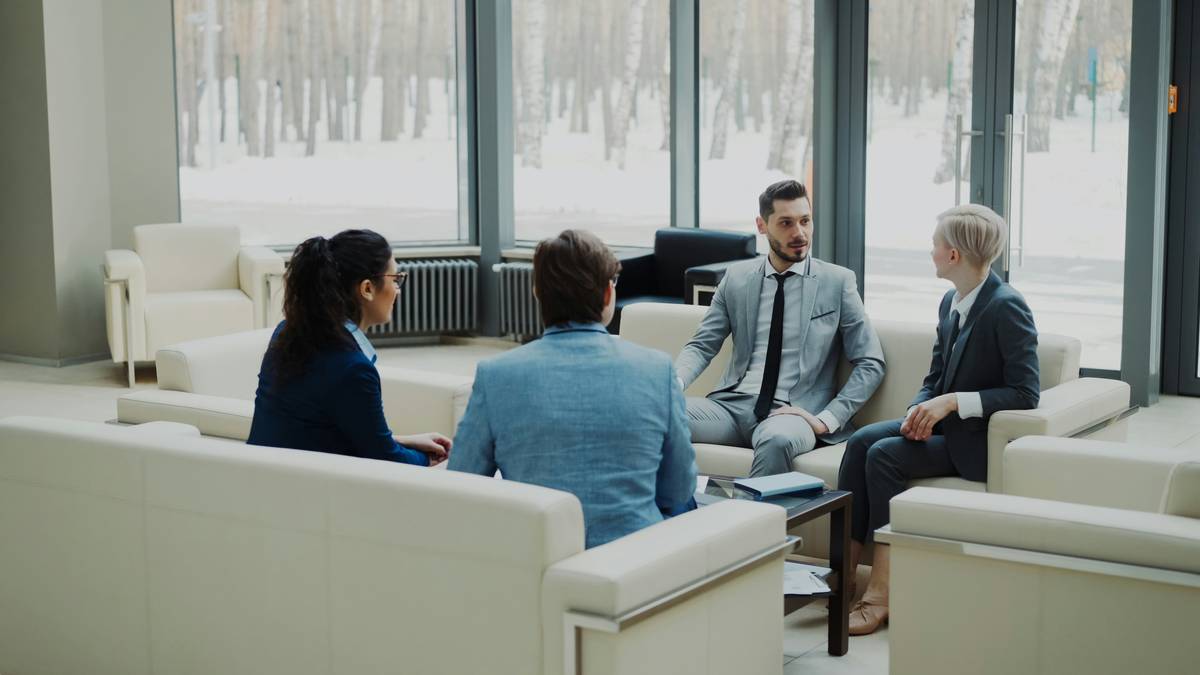 Illustration showing two people discussing risk factors at a meeting table.