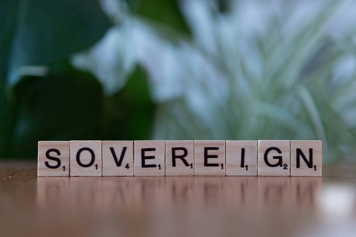 Scrabble tiles spelling sovereignn on a table